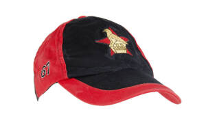 SEAN ERVINE'S ZIMBABWE CRICKET CAP, red & black, with embroidered Zimbabwe logo on front, signed on brim by Sean Ervine. Good match-used condition. [Ervine played 5 Tests & 42 ODIs 2001-04].