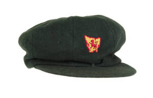 LEN MADDOCKS' TASMANIA CRICKET CAP, green wool with embroidered Tasmanian logo (Lion within map of Tasmania), with name label inside "Maddocks". G/VG condition. [ Maddocks played 7 Tests 1955-56, and played for Tasmania 1963-68].
