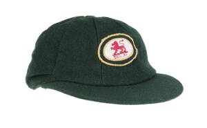 DAVID BOON'S TASMANIA CRICKET CAP, green wool with embroidered Tasmanian logo (Lion over "TAS.XI"), signed inside by David Boon. G/VG condition. [Boon played 107 Tests 1984-96, and played for Tasmania 1978-99].