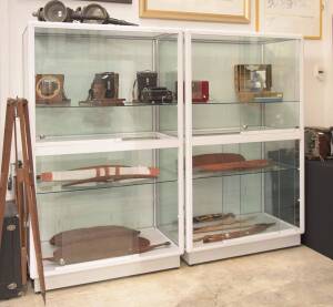 A pair of glazed showcase cabinets. 181cm high, 109cm wide, 60cm deep