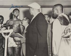 MUHAMMAD ALI, signed b/w photograph of Ali at weigh-in with Sonny Liston, size 51x41cm.