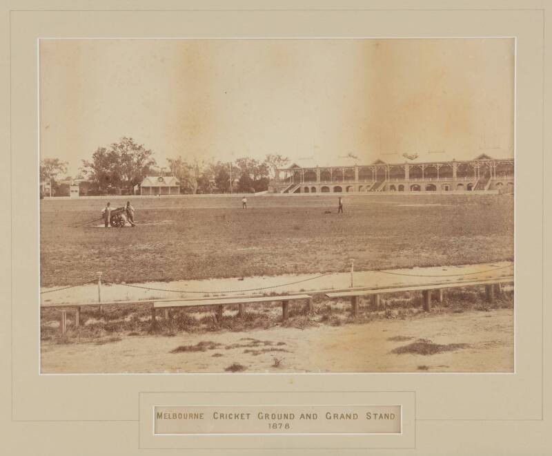 "Melbourne Cricket Ground and Grand Stand, 1878", original photograph by Charles Nettleton (1826-1902), 1878 albumen photograph (36x26cm), showing groundsmen preparing the pitch. Window mounted, framed & glazed, overall 56x48cm. Photograph with minor surf