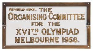 1956 MELBOURNE OLYMPICS: Sign "Regitered Office.. The ORGANISING COMMITTEE For The XVIth OLYMPIAD, MELBOURNE 1956.", gilt on perspex in metal frame, 28x15cm.