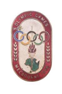 OFFICIAL BADGE FOR COMPETITOR, minted by K.G.Luke, with maroon enamel border, silver background (no ribbon), numbered "5821" on reverse.