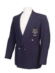 1956 MELBOURNE OLYMPICS: Official's Blazer, navy blue wool with embroidered Olympic Ringss & "OLYMPIC GAMES 1956/ OFFICIAL" on pocket. Good condition.