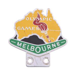 CAR BADGE, attractive badge with torch & "Olympic Games" inside map of Australia, with "Melbourne" inside boomerang below.