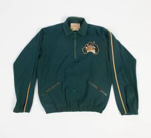 Australian tracksuit top from c1960 Olympics, with badge featuring Australian Coat-of-Arms inside map of Australia (some faults), back with letters "AUSTRALIA" in green on yellow, made by MSD. Fair/Good condition.