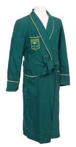 1964 TOKYO OLYMPICS: Australian team dressing gown, green with yellow piping and badge "Australia/ (kangaroo)/ Tokyo 1964/ (Olympic rings)". Good condition.
