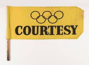 1956 OLYMPICS TRAM FLAG, yellow with black Olympic Rings & "COURTESY".