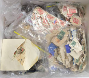 Two large cartons of post-WWII mostly pre-decimal kiloware, mostly on piece. We expect, but can't guarantee, that this hoard is entirely unchecked for varieties or postmarks, making it a potential goldmine for specialists. [See also Lots 590 & 999] (10,00