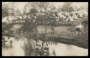 1916 real photo PPC of Mitcham Military Camp (SA) featuring dozens of tents, chopping wood, underground oven & a group of bare-chested soldiers on a makeshift raft, a couple of minor inkspots, used under cover. [The writer, Sapper WW Evans, says "...Tell 