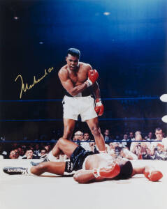 MUHAMMAD ALI, signed colour photograph of Ali standing over Sonny Liston, size 41x51cm. With CoA No.65298.