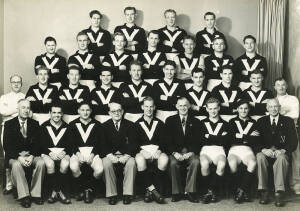 1954 VICTORIAN TEAM, team photograph with title "Victorian Football League Representative Team, Matches at Perth and Adelaide, 1954", with scores and players names printed on mount, overall 31x25cm. Fair/Good condition. Team includes Ken Hands (captain), 
