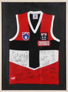 ST.KILDA: c1997 St.Kilda football jumper with 30 signatures, noted Robert Harvey, Nathan Burke & Stewart Loewe, framed & glazed, overall 71x94cm.