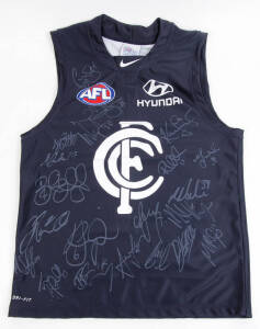 CARLTON: 2012 Carlton football jumper with 21 signatures including Chris Judd, Bryce Gibbs, Jordan Russell, Matthew Kreuzer & Eddie Betts. Together with list of players who have signed.