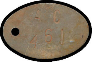 HAY: Internee Idendity Dog Tag, incscribed 'SCHMIDT/ O.V.' and 'A C / 461' on reverse, oval base metal (42 x 28mm).