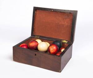A selection of antique billiard and snooker balls, many ivory examples, includes mahogany box. (18 balls) 