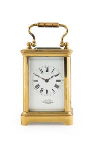Miniature carriage clock in case with key, French movement and dial marked "JOHN CARTER, LONDON". 