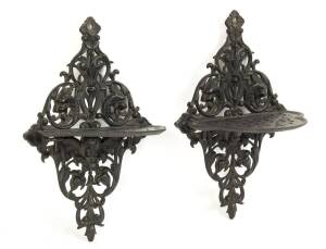 A pair of Russian finely cast iron wall brackets, foundry mark for Kasli on reverse and dated 1901. 23cm high.  