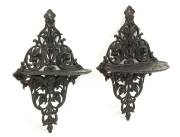 A pair of Russian finely cast iron wall brackets, foundry mark for Kasli on reverse and dated 1901. 23cm high.  