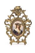 A pair of miniature portraits painted on porcelain in ornate gilt frames, made in Germany, titled verso "Madame Vigie-Lebrun" and "Eliza", 19th century. Frames 20 x 15cm