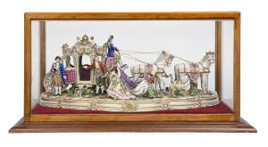 A fine German porcelain Royal carriage and horses, blue crown Naples mark, housed in a purpose built glass and timber display cabinet. 63cm long