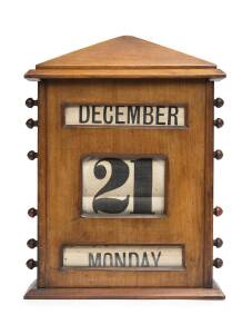 A walnut desk calender, circa 1900. 34 x 25cm