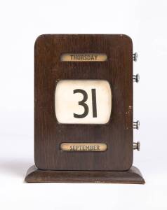 An oak desk calender, circa 1920s. 19cm high