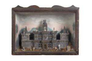 A 19th century diorama in case of a castle scene, English. 60cm high, 79cm wide, 31cm deep