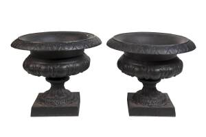 A pair of Victorian style black cast iron urns. 43cm high, 55cm diameter