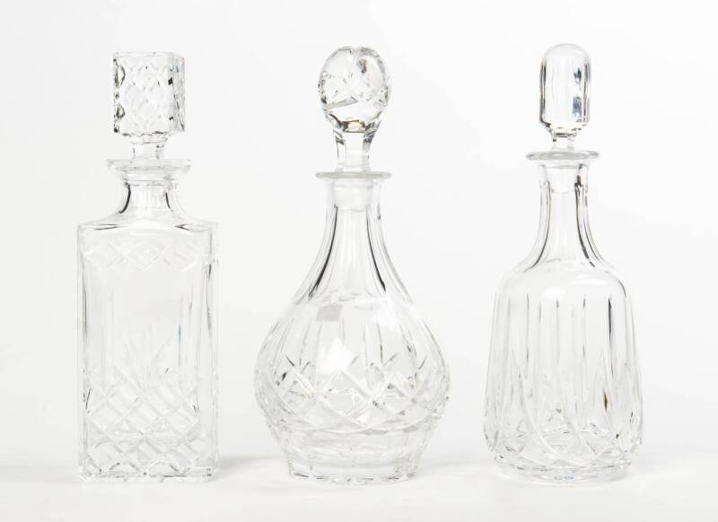 Three cut crystal decanters including Royal Doulton. Tallest 31cm high