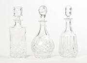 Three cut crystal decanters including Royal Doulton. Tallest 31cm high