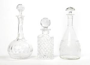 Group of three cut crystal decanters. Largest 30cm high