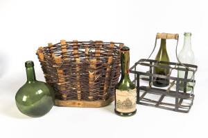 Antique French wine bottle carrier, woven stick basket & four assorted French wine bottles. 