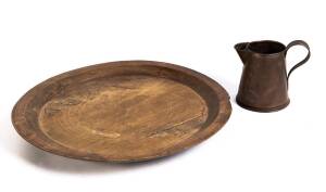 A rustic French wooden platter and a copper pitcher