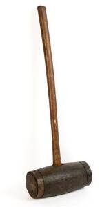 A large timber and iron bound mallet. 93cm. 