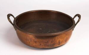 A copper preserving pan, 19th century. 46cm across the handles.