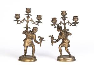 Pair of figured brass candelabra, early to mid 20th century. 34cm