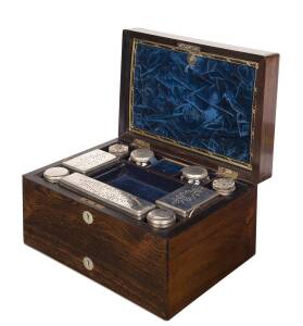 Ladies traveling box, rosewood with original blue velvet fitted interior including silver plated bottles and inkwells, mid 19th century. 18cm high, 32cm wide, 23cm deep