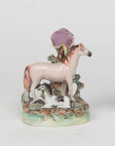 A rare Staffordshire pottery figure of a horse and dog, 19th Century