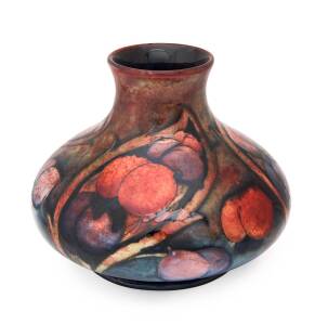 Moorcroft pottery flambe "Wisteria" patterned vase, circa 1920. 14cm high, 18cm wide