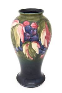 Moorcroft "Leaves and Berries" pottery vase, circa 1930s. 22cm