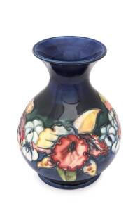 Moorcroft pottery "Orchid" pattern baluster shaped vase, circa 1950s. 15cm