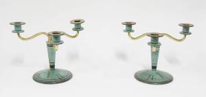 A pair of WMF patinated brass Art Deco three branch candlesticks, German, circa 1920, 20cm high.