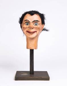 A ventriloquist puppet head on stand, early 20th century. Head 26cm