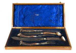 A carving set in walnut box with brass plaque "WERRIBEE C.C. JOHNNY WALKER TROPHY, Won By, 30.5.19". Box 6cm high, 49cm wide, 24cm deep