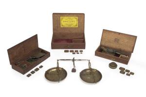 Three boxed sets of gold scales and assorted weights, 19th Century.