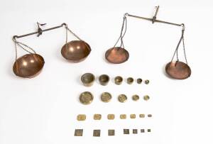 Two sets of hand held gold scales with copper pans accompanied by 3 assorted sets of weights, 19th Century. 