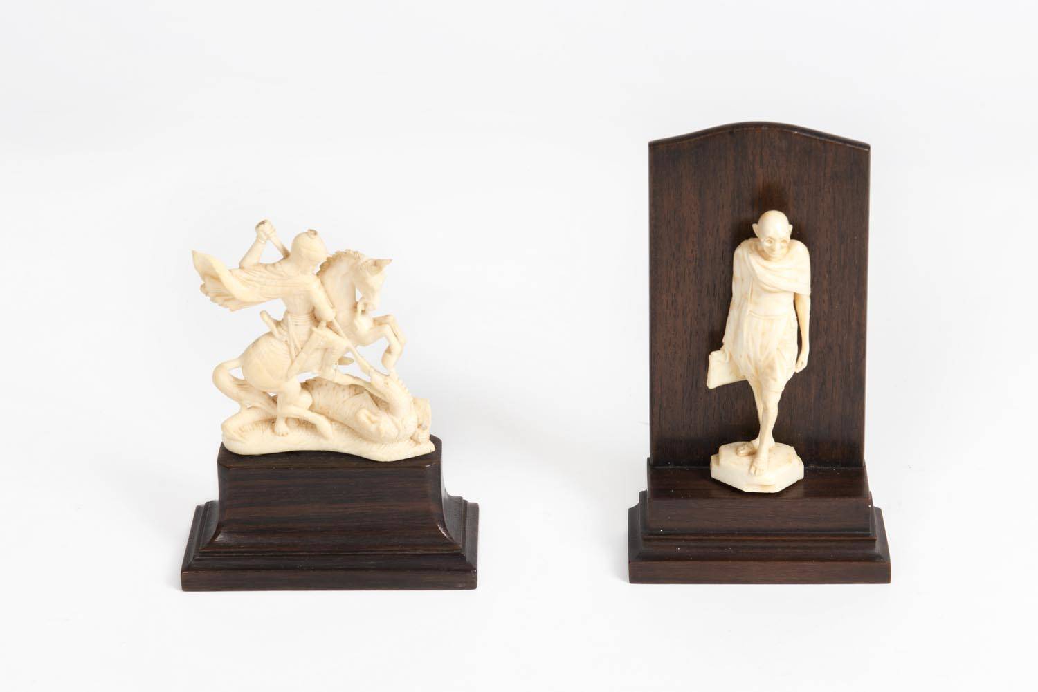 An Indian ivory statue of Mahatma Gandhi mounted on wooden plinth (16cm ...
