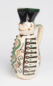 An unusual faience character jug Hungarian, Circa 1920. 41cm high